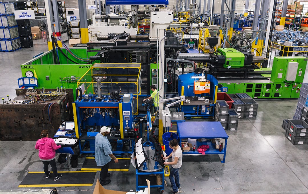 Workers in injection molding facility