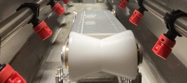 Adjustable position product support rollers
